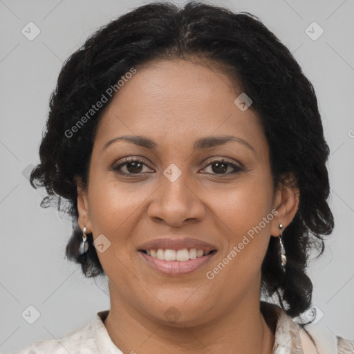 Joyful latino adult female with medium  brown hair and brown eyes