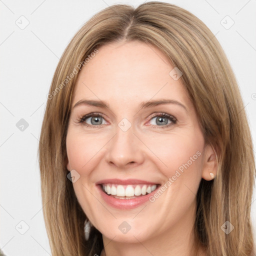 Joyful white young-adult female with long  brown hair and green eyes