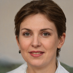 Joyful white adult female with short  brown hair and grey eyes