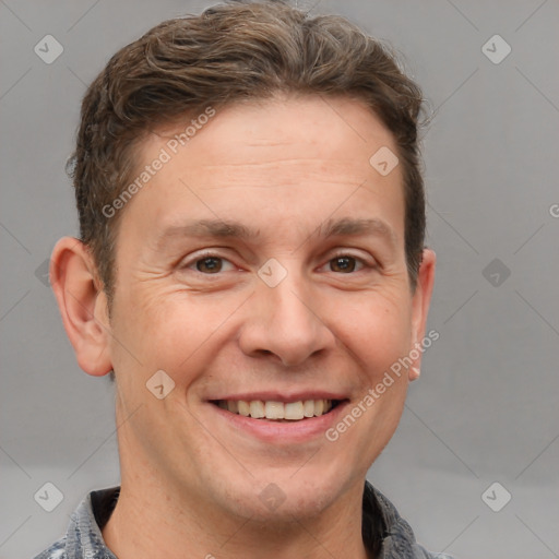 Joyful white adult male with short  brown hair and grey eyes