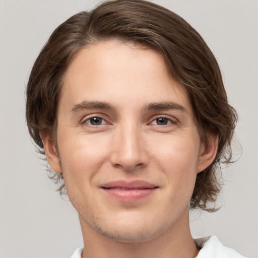 Joyful white young-adult male with medium  brown hair and brown eyes