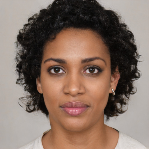 Neutral black young-adult female with medium  black hair and brown eyes