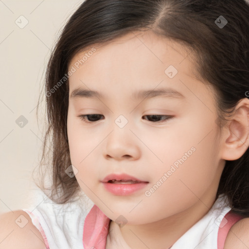 Joyful white child female with medium  brown hair and brown eyes