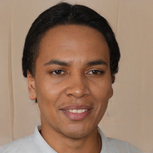 Joyful black young-adult male with short  brown hair and brown eyes