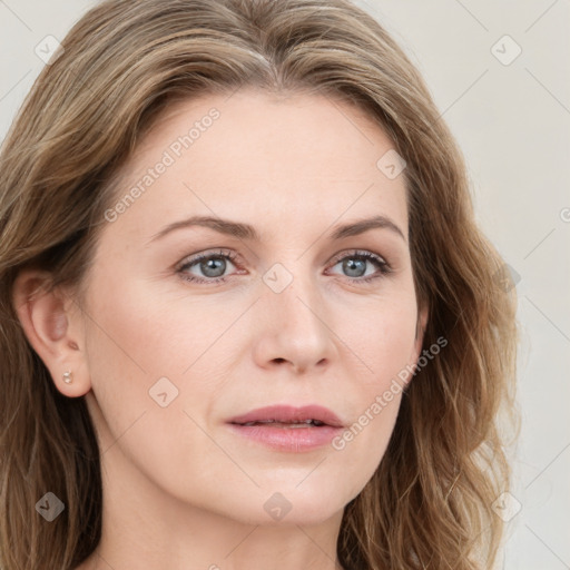 Joyful white young-adult female with long  brown hair and blue eyes