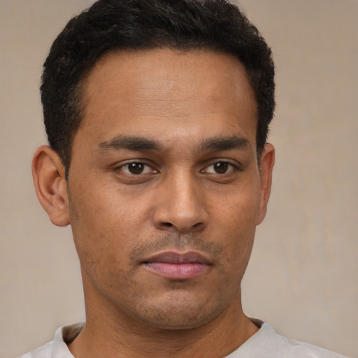 Neutral latino young-adult male with short  brown hair and brown eyes