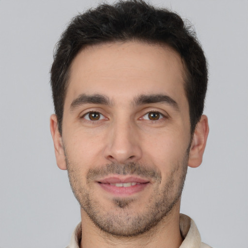 Joyful white young-adult male with short  brown hair and brown eyes