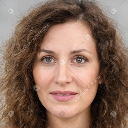 Joyful white adult female with long  brown hair and brown eyes