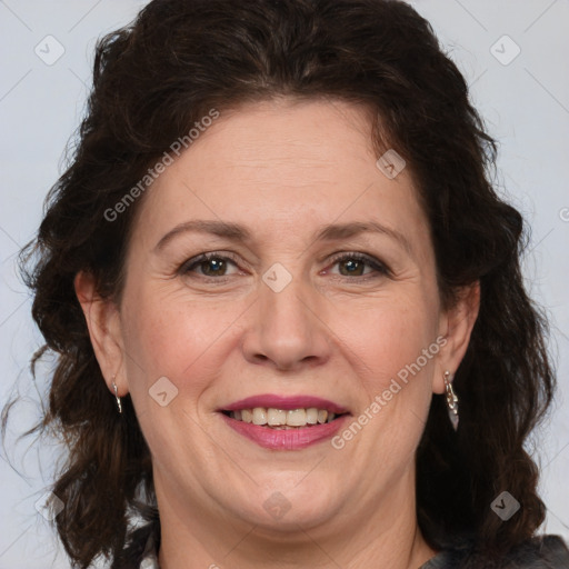 Joyful white adult female with medium  brown hair and brown eyes