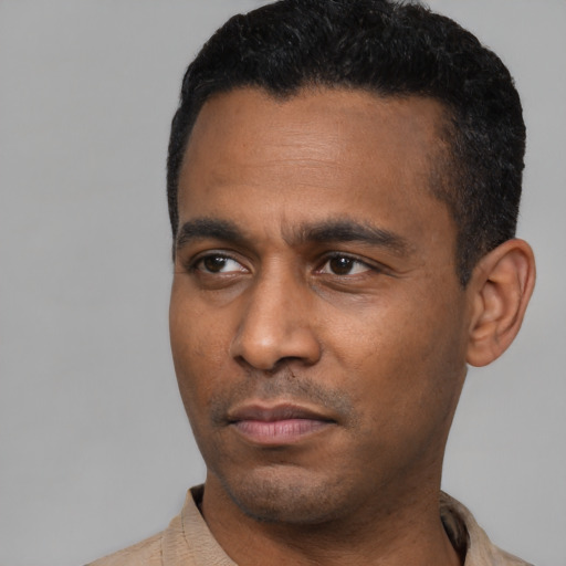 Neutral latino young-adult male with short  black hair and brown eyes