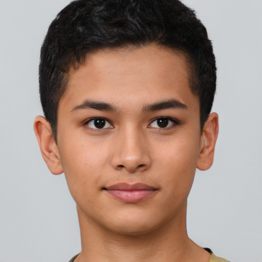 Joyful latino young-adult male with short  brown hair and brown eyes