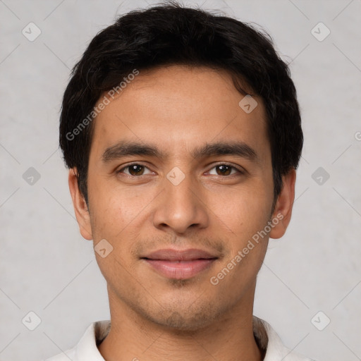 Joyful white young-adult male with short  black hair and brown eyes