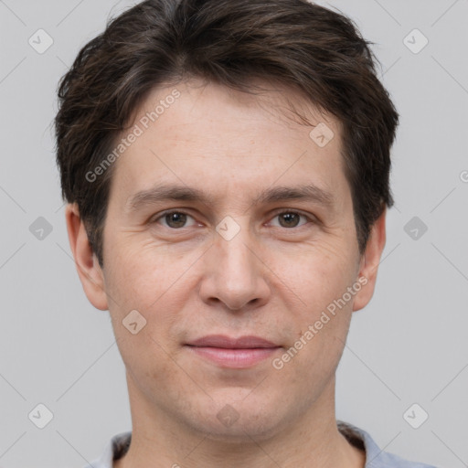 Joyful white adult male with short  brown hair and brown eyes