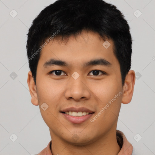 Joyful asian young-adult male with short  black hair and brown eyes