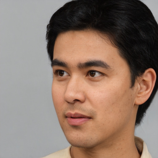 Neutral asian young-adult male with short  black hair and brown eyes