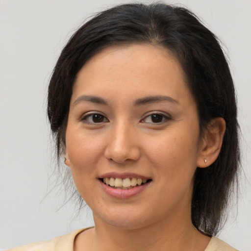 Joyful white young-adult female with medium  brown hair and brown eyes