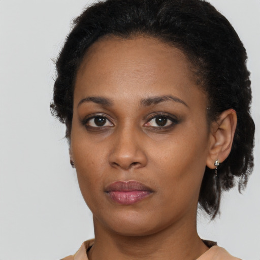 Neutral black young-adult female with short  brown hair and brown eyes