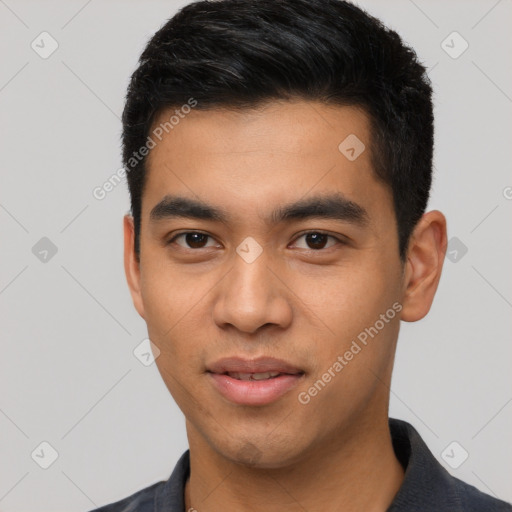 Joyful latino young-adult male with short  black hair and brown eyes