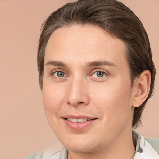 Joyful white young-adult male with medium  brown hair and brown eyes