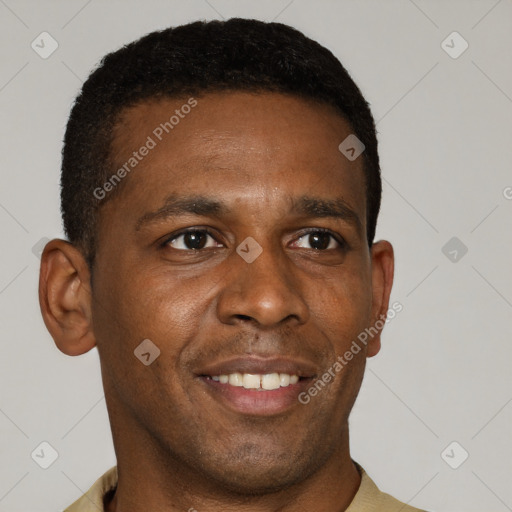 Joyful black young-adult male with short  brown hair and brown eyes