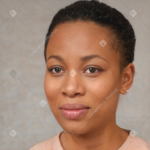 Joyful black young-adult female with short  black hair and brown eyes