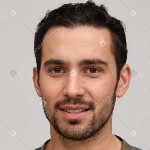 Joyful white young-adult male with short  black hair and brown eyes