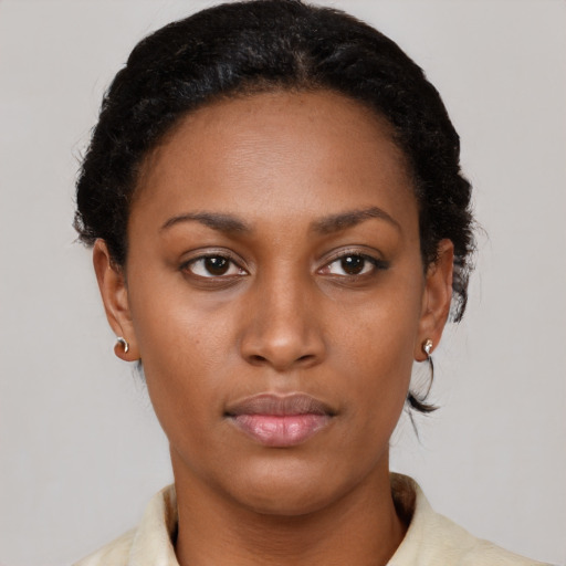 Neutral black young-adult female with short  brown hair and brown eyes