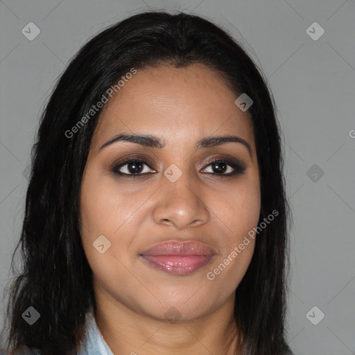Joyful black young-adult female with long  brown hair and brown eyes