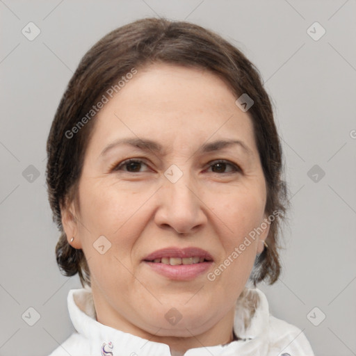 Joyful white adult female with medium  brown hair and brown eyes