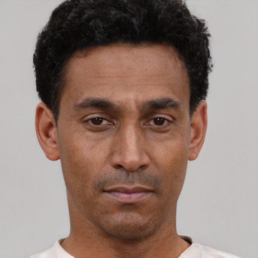 Neutral black adult male with short  brown hair and brown eyes
