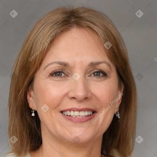 Joyful white adult female with medium  brown hair and grey eyes