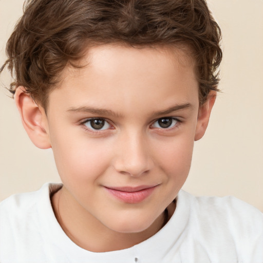 Joyful white child male with short  brown hair and brown eyes