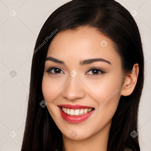 Joyful white young-adult female with long  black hair and brown eyes