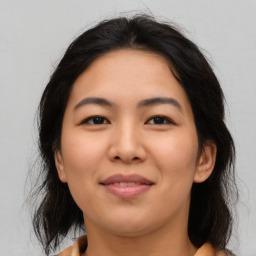 Joyful asian young-adult female with medium  brown hair and brown eyes