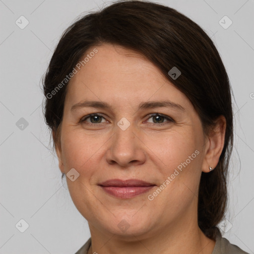 Joyful white adult female with medium  brown hair and grey eyes