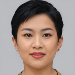 Joyful asian young-adult female with short  black hair and brown eyes