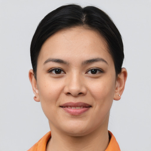 Joyful asian young-adult female with short  brown hair and brown eyes