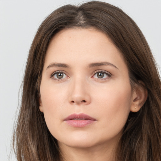 Neutral white young-adult female with long  brown hair and brown eyes