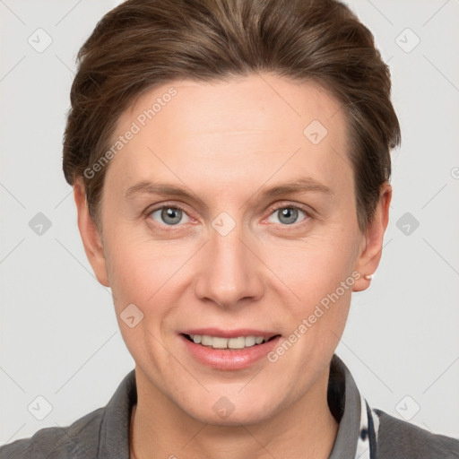 Joyful white adult female with short  brown hair and grey eyes