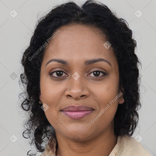 Joyful black adult female with long  brown hair and brown eyes