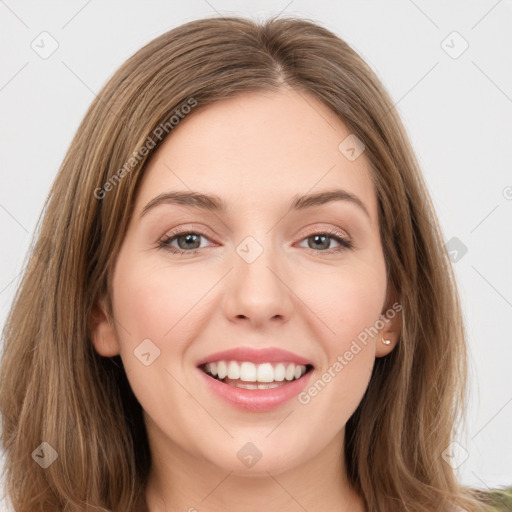 Joyful white young-adult female with long  brown hair and green eyes