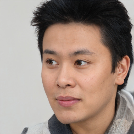 Neutral asian young-adult male with short  black hair and brown eyes