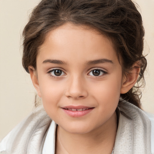 Joyful white child female with medium  brown hair and brown eyes