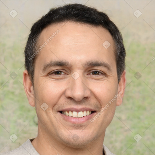 Joyful white adult male with short  brown hair and brown eyes