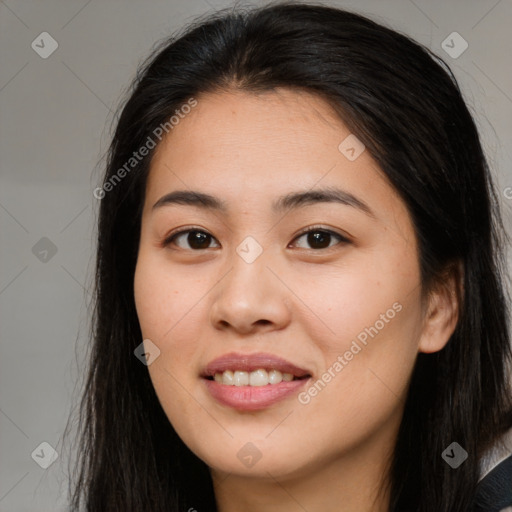 Joyful asian young-adult female with long  brown hair and brown eyes