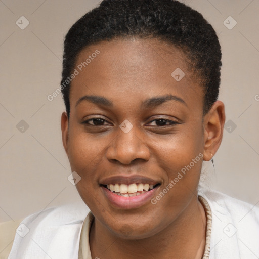 Joyful black young-adult female with short  brown hair and brown eyes