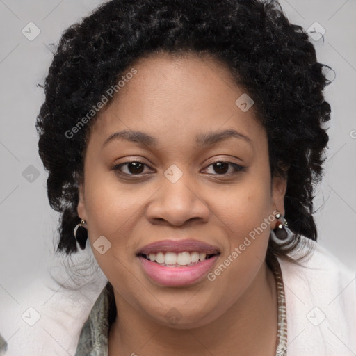 Joyful black young-adult female with long  brown hair and brown eyes