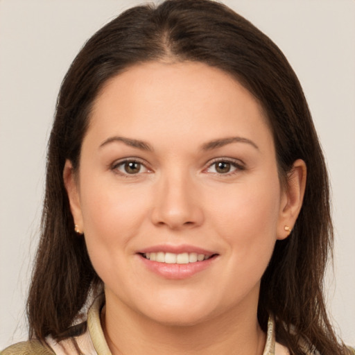 Joyful white young-adult female with medium  brown hair and brown eyes