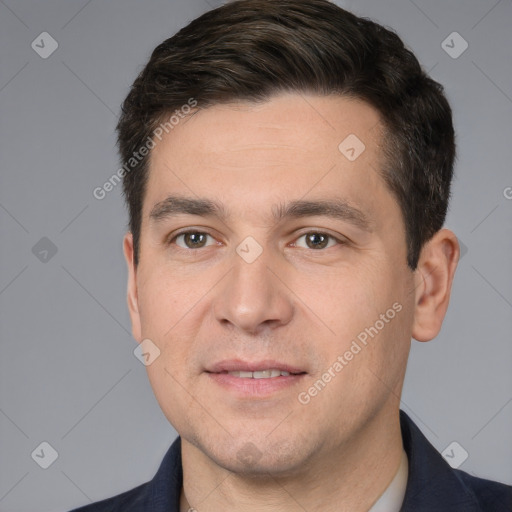 Joyful white adult male with short  brown hair and brown eyes