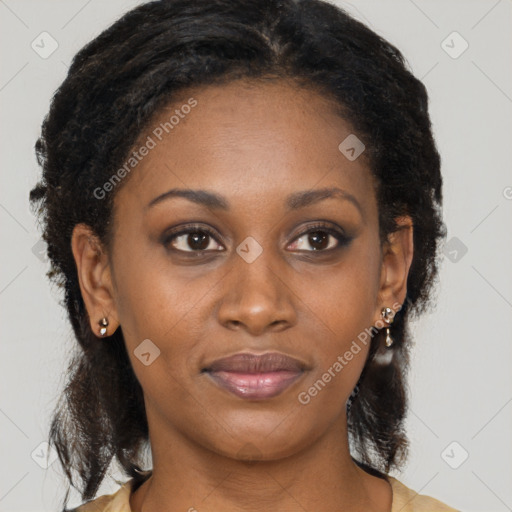 Joyful black young-adult female with long  brown hair and brown eyes